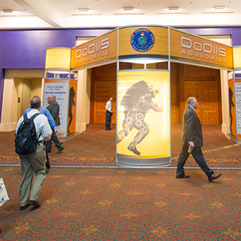 see us in action photo attendees in front of graphics